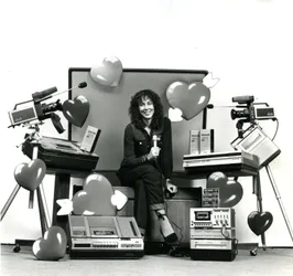 Wendy Clarke and Mare Lodu look at a bank of monitors while digitizing a tape